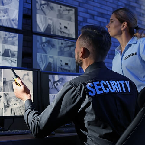 Security officers watching security footage