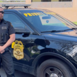 Patrol guard next to patrol vehicle