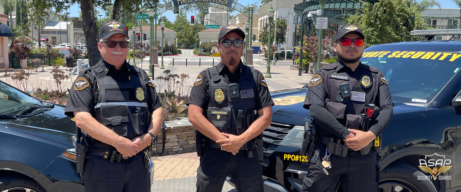 Three ASAP Security Guards by patrol cars