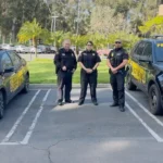 Professional security guard providing parking lot security services at a commercial property