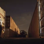Professional security guard at a San Diego warehouse loading dock during evening hours