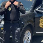Security guard outside an animal shelter entrance during daytime