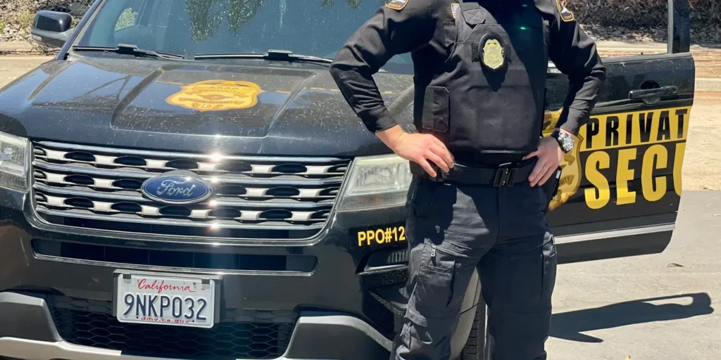 Security guard monitoring the entrance to an auto repair shop after hours