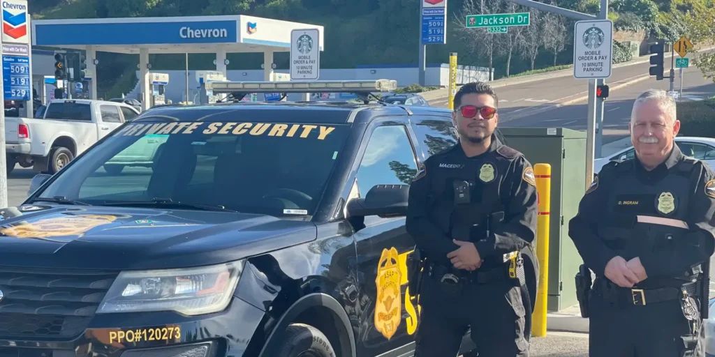 Security professional standing at a commercial property entrance in California