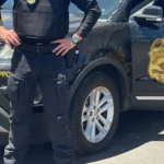 Security supervisor reviewing a site activity report with a guard at a commercial property