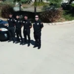 Security trainees reviewing course materials during a California training session
